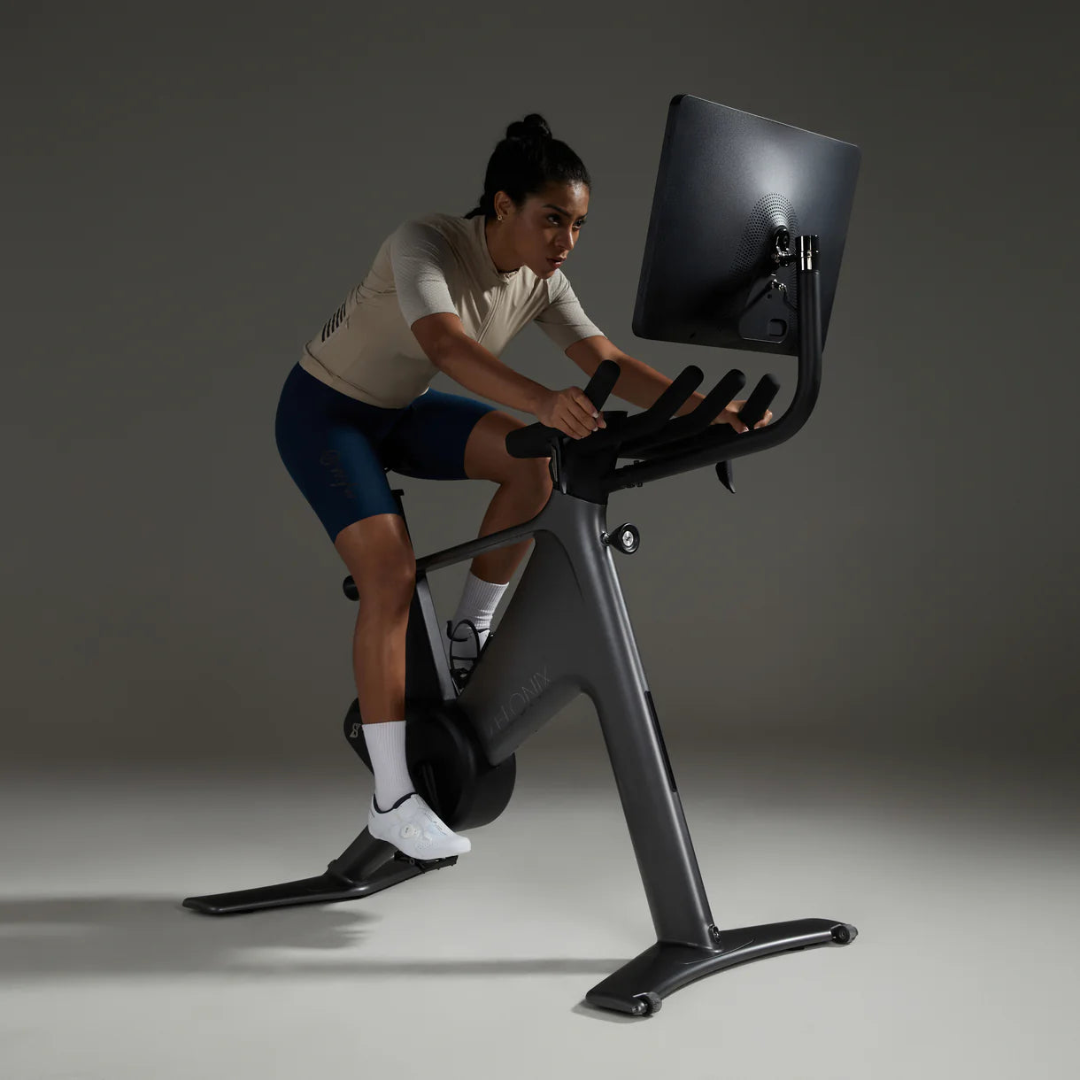 Rider in aerodynamic position on Speediance VeloNix